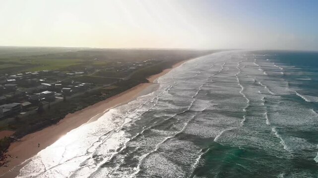 Aerial view of beach and waves in Coorong National Park, Australia. Slow motion