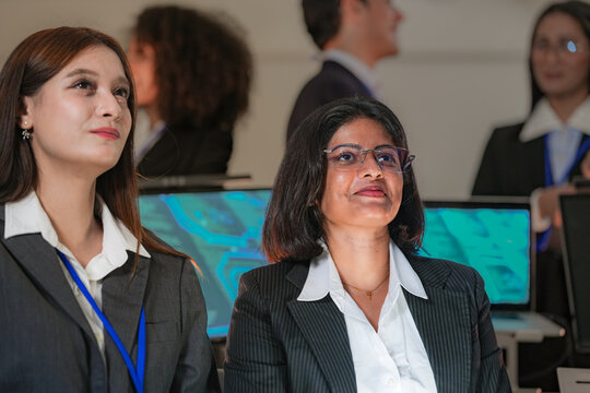 Team of analysts working together at a shared desk in a professional boardroom, double-checking results, in a scene about strategy and clean corporate atmosphere.