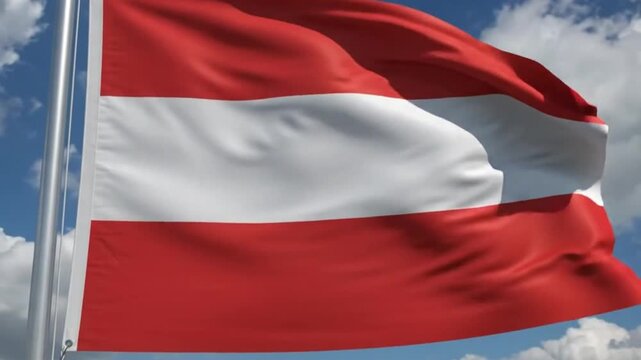 The national flag of austria waving in the wind against a blue sky