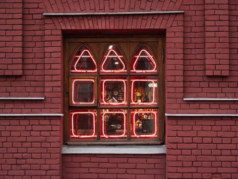 Bright Neon Lights Framing Vintage Window Design