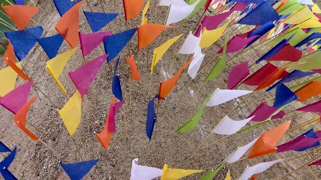 Colorful paper triangle flags on sand pagoda during Songkran festival