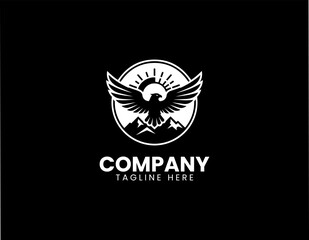 Fototapeta premium Eagle with wings spread mountain sunrise minimalist black vector logo wildlife badge emblem