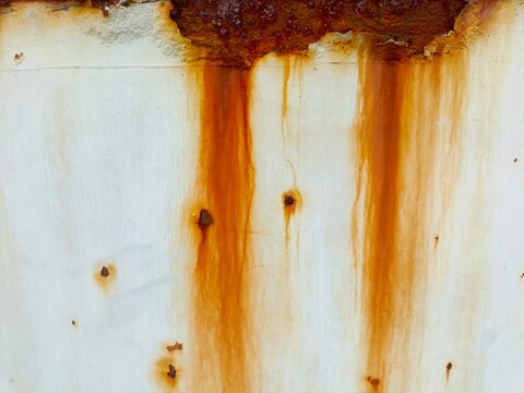 old rusty iron panel texture with orange brown corrosion stains