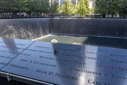 View of 9/11 victims' names and a birthday rose on the North Memorial Pool, at the National September 11 Memorial and Museum, with view of victims&rsquo; names, on June 4, 2026 in New York City, New