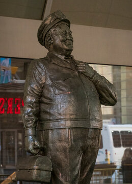 New York, NY - US - Jun 20, 2026 This bronze statue depicts Ralph Kramden, Jackie Gleason&rsquo;s iconic character from The Honeymooners, wearing his bus driver uniform and cap while holding a lunchbox.