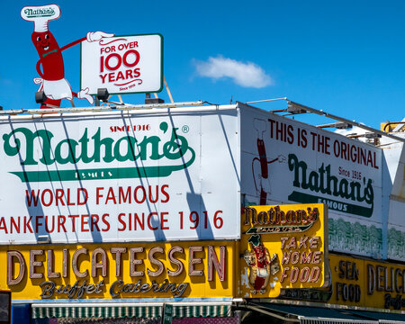 Brooklyn, NY - US - Jun 20, 2026 Nathan&rsquo;s Famous storefront at Coney Island with bold vintage signage, iconic hot dog mascot, and bright colors celebrating over a century since 1916.