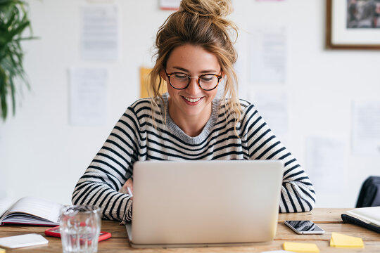 The woman builds a calm workspace at her home office desk 
