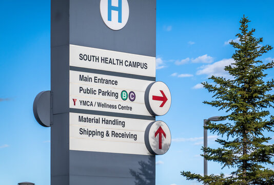 Calgary, Alberta, Canada. June 22, 2026. South Health Campus directional hospital pylon sign showing entrance routes under a blue sky.