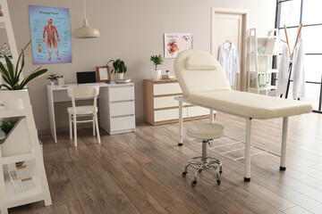 Fototapeta premium Interior of medical office with couch, door and doctors workplace