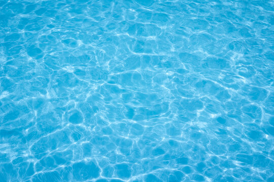 The light reflects blue in the water in the swimming pool. It looks fresh and lively, suitable for use as a wallpaper.