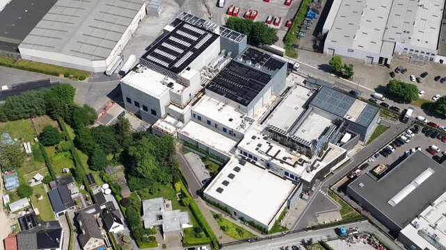 erial drone view of a Brussels hyperscale data center, showing cloud computing, AI infrastructure, power and cooling systems.