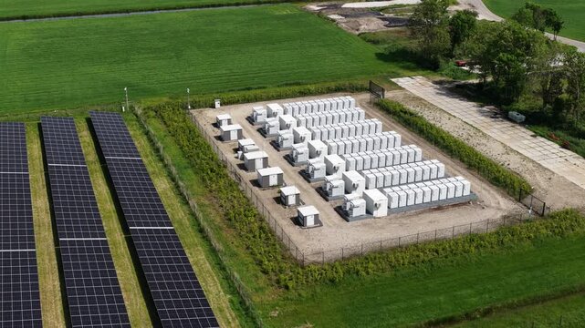 Aerial drone view of a large battery energy storage system for a solar farm, showcasing a clean energy solution for storing electricity and supporting grid stability with renewable resources