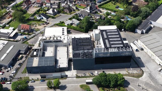 Aerial drone view of a massive data center, showing cloud computing, server infrastructure, power systems, cooling and secure IT operations.