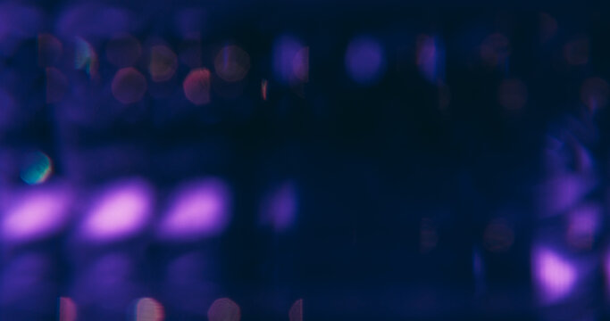 Blur flare light. Twinkle decorative. Defocused blue purple neon lens sparkle glare gleam optical shine glow on abstract bokeh dark black background.