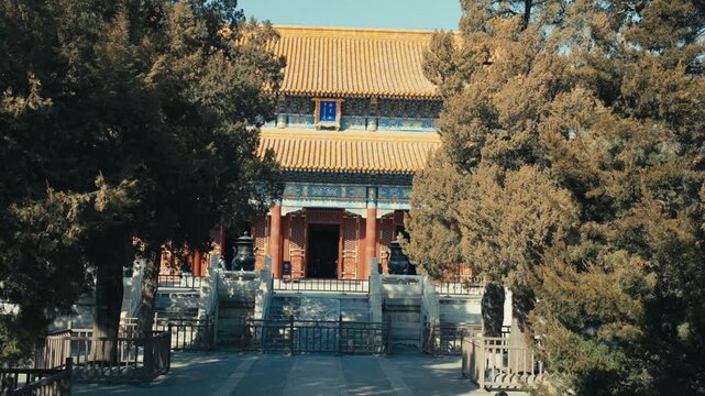 Beijing Temple of Earth Imperial Hall with Double Yellow Tiled Roof Framed by Ancient Trees