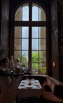 the interior of Le Grand Caf&eacute; in Paris, renowned for its restoration by designer Joseph Dirand.