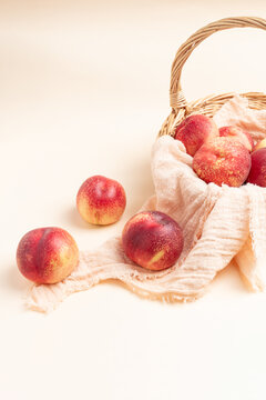  Fresh nectarine against a beige background