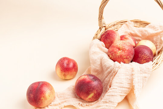  Fresh nectarine against a beige background