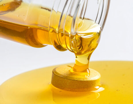 Honey Pouring onto a Pill as a Sugarcoating Concept