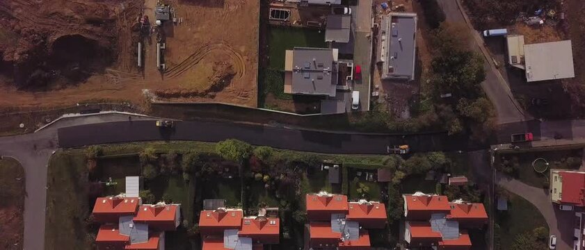 Top down view showing red roof houses and street