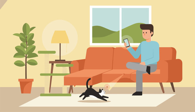 Man sitting on a comfortable sofa and using smartphone app to play with his cat using smart laser pointer.