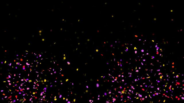 Confetti pieces fall in a festive display against a deep black background to signify a celebration or a party atmosphere where joy and excitement are the central themes of the visual composition.