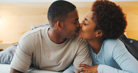 Obraz premium Wake up, kiss or couple in bed with love, partner care or bonding together in connection. Tender, loyalty or African people with affection, romantic moment or morning routine in healthy relationship.