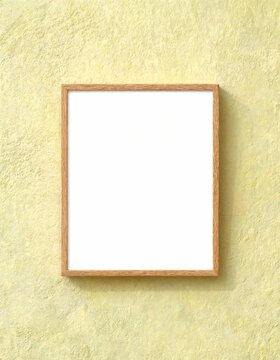Wooden picture frame with an empty white space hanging on a vibrant yellow textured wall, offering a clean background for advertising, gallery art, or home decor concepts