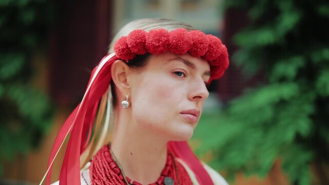 Beautiful lady in authentic vyshyvanka and red wreath. A portrait reflecting the unconquerable spirit of the strong Ukrainian nation, capturing profound resilience, pride, and deep devotion to roots.