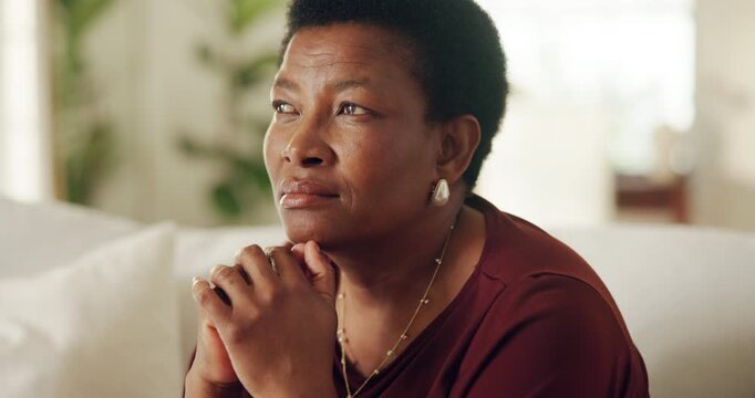 Black woman, senior and thinking on couch in home, contemplating or daydreaming with wonder. Female person, mature and perspective, nostalgia or remember with memory, insight or vision in house