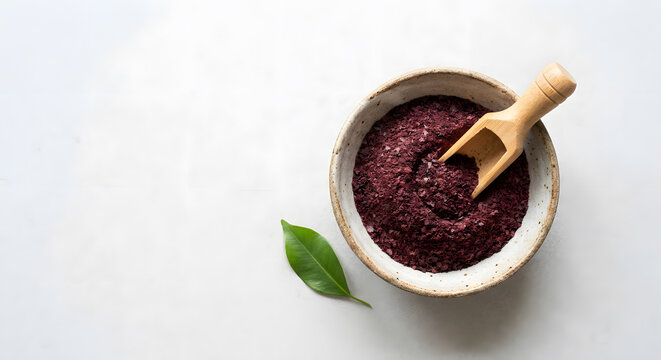 Pine bark extract powder in ceramic bowl with wooden scoop
