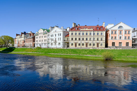 The Golden Embankment quarter on the banks of the Pskova River on a sunny day, Pskov region of Russia