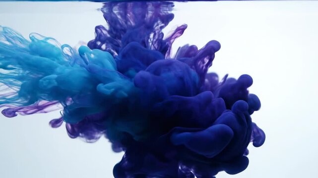 Blue and purple ink clouds blooming in water, abstract fluid dynamic shapes, vibrant colors swirling, macro shot, great for background or texture