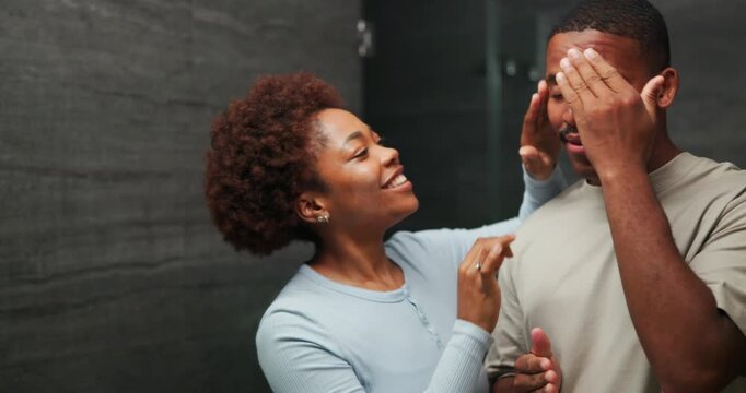 Cream, mirror and black couple in home bathroom with bonding, self care and together for skincare. Happy man, woman and reflection in house with dermatology, grooming and hygiene with lotion for glow