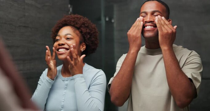 Skincare, mirror and black couple kiss in home bathroom with bonding, self care and together. Happy man, woman and reflection in house with dermatology, grooming and hygiene with lotion for glow
