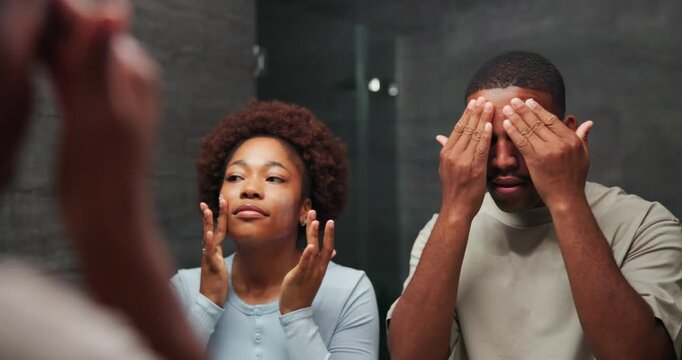 Couple, mirror and cream in home for skincare with bonding, self care and together in bathroom. Black man, woman and reflection in house with dermatology, grooming or hygiene with lotion for wellness