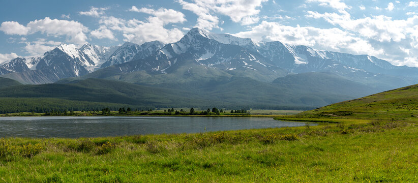 A beautiful alpine panoramic view of a high-mountain lake
