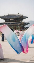 Flowing colorful fabric installation in front of a historic Korean palace, blending modern celebration with traditional heritage during Liberation Day festivities.