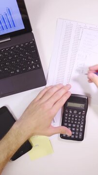 Successful business person writing down incomes