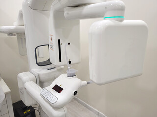 Dental x-ray scanner in a clinic. Modern panoramic radiograph machine for teeth examination....
