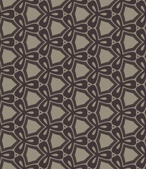 Fototapeta premium A patterned carpet with a brown and tan color scheme. The carpet is made of a material that is not visible