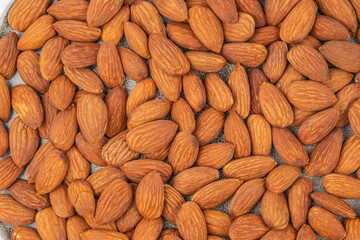 Fototapeta premium Raw almonds background texture top view