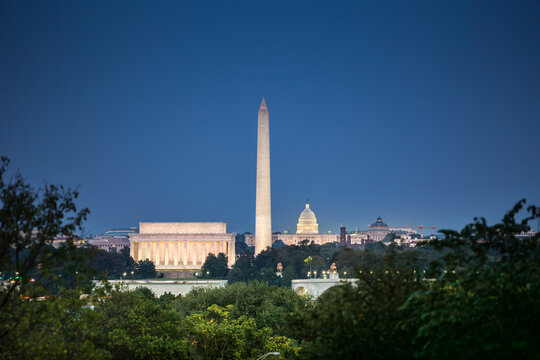Illuminated Washington DC skyline landmarks at twilight