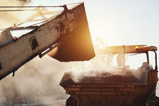 Constructing New Roads With Asphalt Paving Under Bright Sunlight