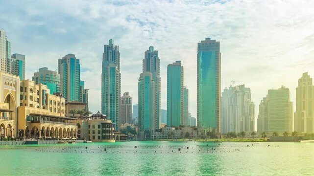 Scenic panorama view of skyscrapers at sunset of Old Town Island and Dubai Mall, around the Burj Khalifa Lake, Dubai Downtown.