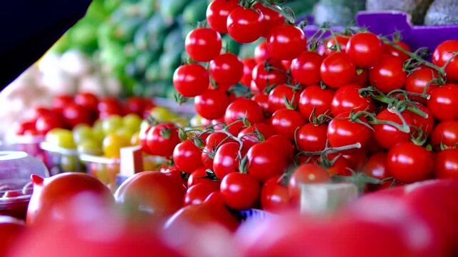 red cherry tomatoes at market. vibrant cluster of ripe, red cherry tomatoes