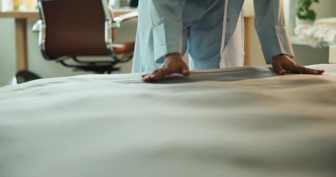 Hands, woman and making bed for housework, responsibility and maintenance at apartment. Person, clean blanket and tidy bedroom with fresh fabric, daily chores or morning routine with mattress at home