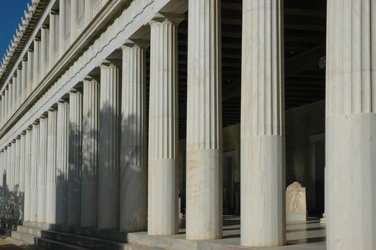 A close up perspective view of the fluted marble columns of the ancient Stoa of Attalos building in Athens