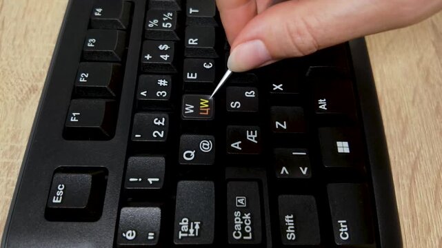 Applying Gaming WASD Cyrillic Stickers on Keyboard for Multilingual Typing