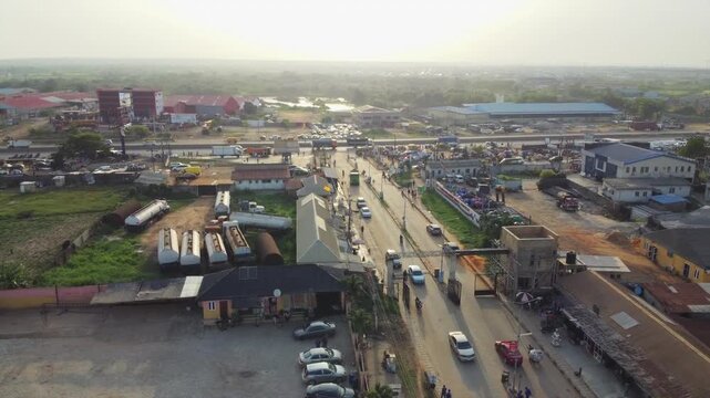 Aerial view of Arepo Bus Stop and Balogun Crescent with vehicles on the road and surrounding buildings in Ofada, Ogun State, Nigeria.
